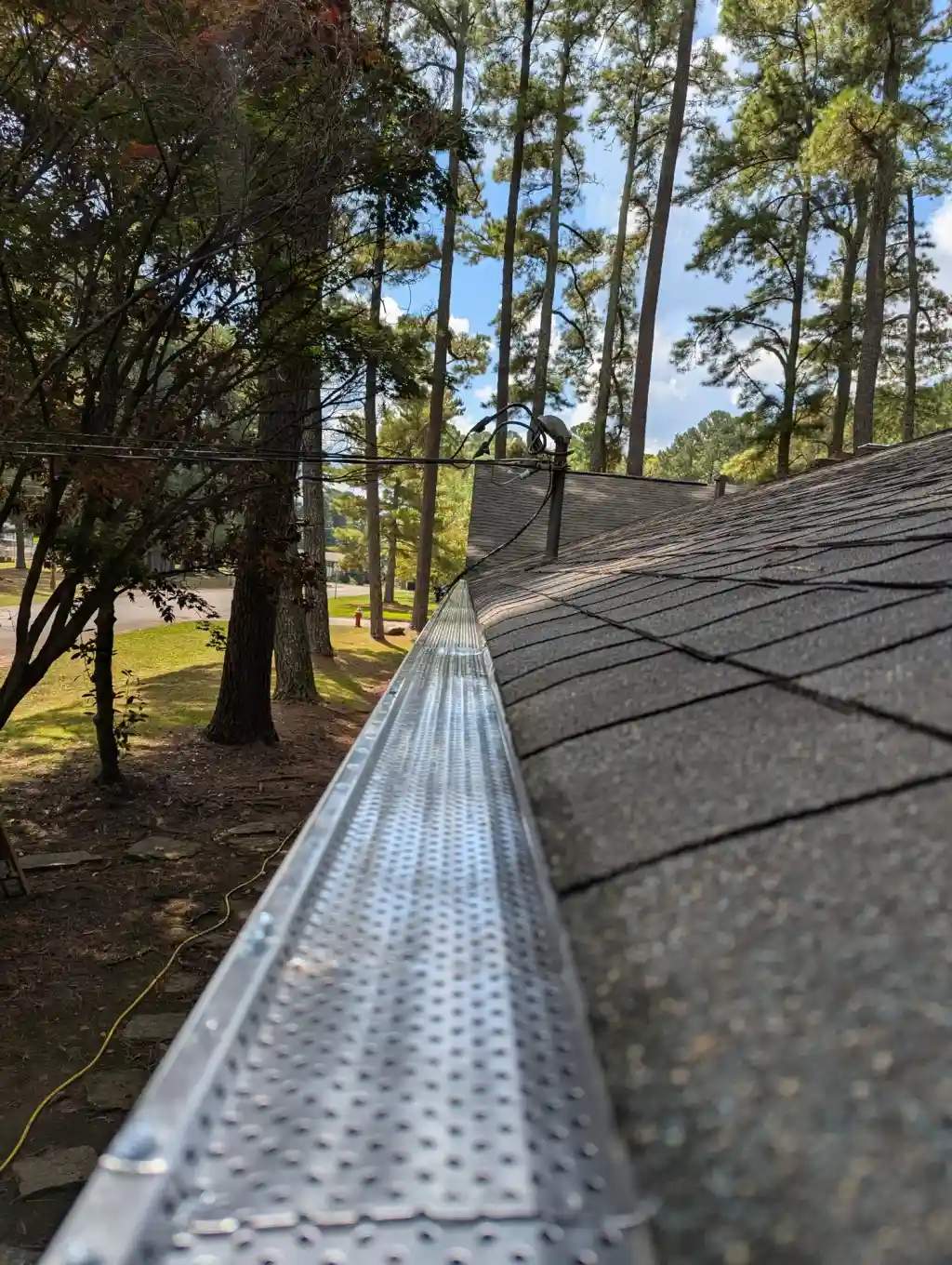 Newly installed seamless aluminum gutters on a North Alabama home